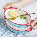 Ixora hand painted ceramic oval bakewareIXORA EXPORTSIxora hand painted ceramic oval bakeware with handles 22 cm